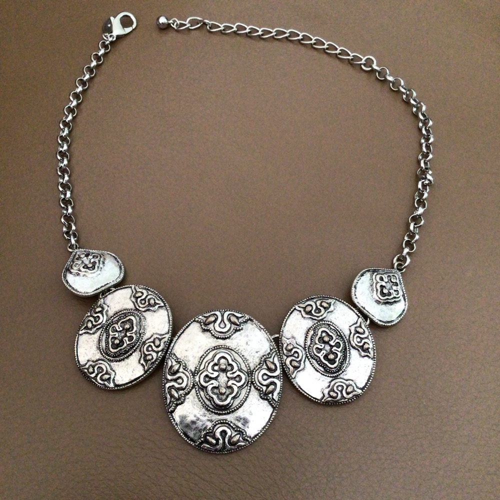 Chico’s heavy massive necklace.